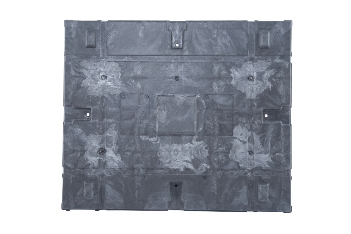 A black plastic sheet with holes, resembling a plastic pallet.