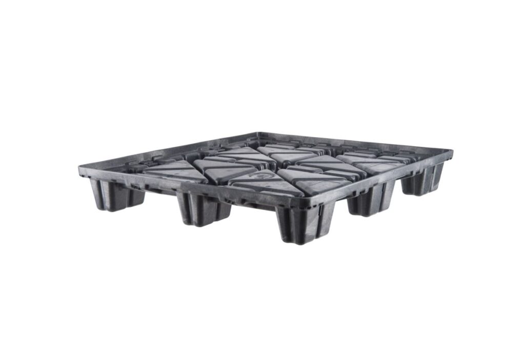 A black plastic tray with four compartments used for organizing items.