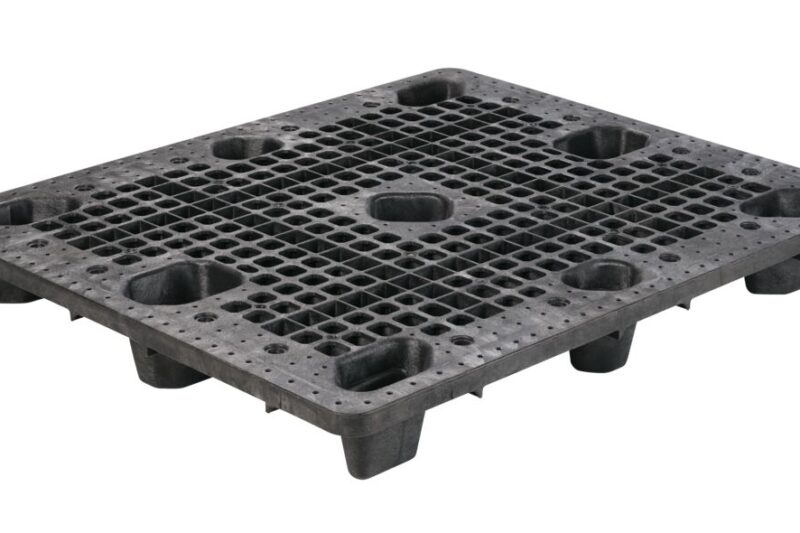 A black plastic pallet with holes.