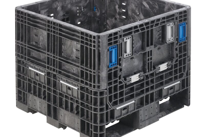 The HDR3230-25 is a large black industrial plastic bulk container with blue handles and reinforced sides, ideal for heavy-duty shipping or storage.