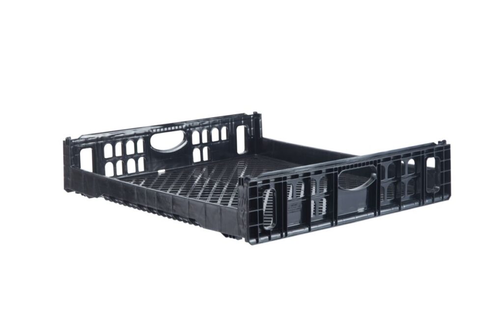 A black plastic stackable crate, often used as a bakery tray, features a lattice design and handle cutouts. It's photographed against a plain white background.