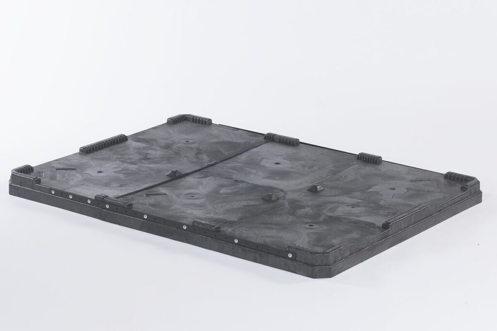 The CHDRT6548 black plastic lid for 65x48 bulk container on white background